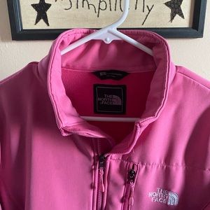 Woman’s pink Northface coat.